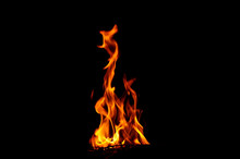 Close-up Of Fire Against Black Background