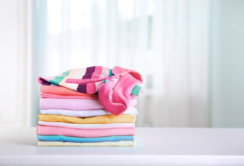 Wall Mural - Stack of colorful cotton clothes.Household concept.Stacked laundry.