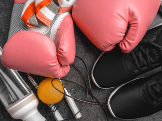 sport sneakers, leather boxing gloves, jump rope, ball, water