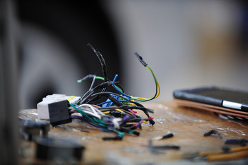 Electrical wire repairs in car audio.