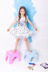 little cute girl with instruments for renovation apartment room isolated on white background.
