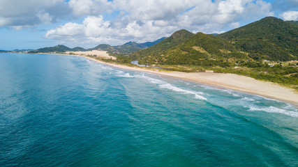 Wall Mural - Aerial view of Siriú beach - Garopaba. Beautiful beach between mountains in Santa Catarina, Brazil