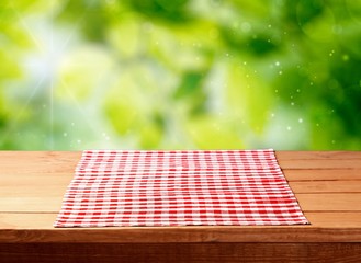 Poster - Empty wooden table with a red tablecloth