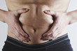 Man touches his fat belly closeup, obesity, male weight loss and diet concept