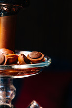 Toffifee fudge in a shisha vase as a snack to a sweet hookah, close up