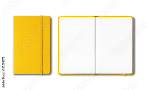 Fotografía Yellow closed and open notebooks isolated on white