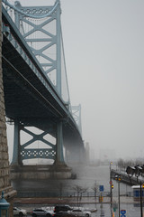 PHILADELPHIA, PENNSYLVANIA, USA - MARCH 19, 2018: View of Ben Franklin Bridge in snowy and foggy weather