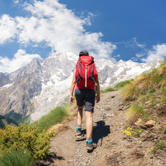 A lone hiker on a Hiking trail in the French Alps near Chamonix, France