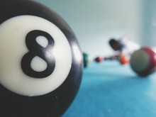 Close-up Of Pool Ball With Number 8 On Table