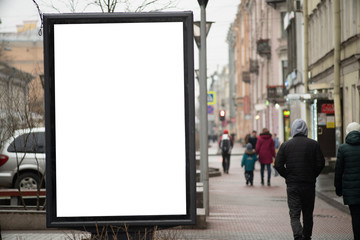 Wall Mural - Advertising sign vertical billboard in the city on a busy street