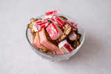 Fototapeta Kwiaty - sweets in a bowl on a white background