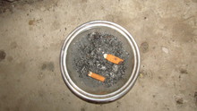 Close-up High Angle View Of Cigarette Butts In Ashtray