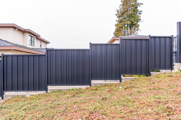 Wall Mural - Fence built from balck metal. Outdoor landscape. Security and privacy concept. Vancouver. Canada.