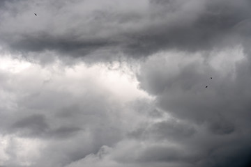 Wall Mural - Dark storm sky with light part, overcast sky