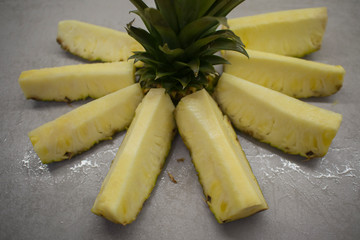 sliced fresh pineapple on the kitchen table