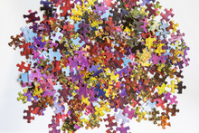 Abstract And Colourful Puzzle Pieces Scattered On A Table