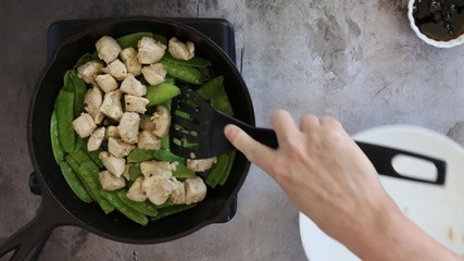 Wall Mural - Cooking Stir Fried Chicken and Snow Peas