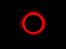 Close-up Of Illuminated Red Circle Over Black Background