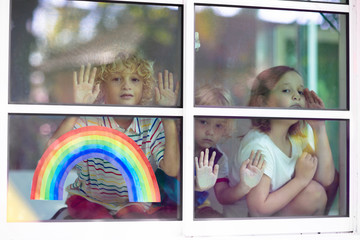 Wall Mural - Coronavirus quarantine. Kids at window. Stay home.