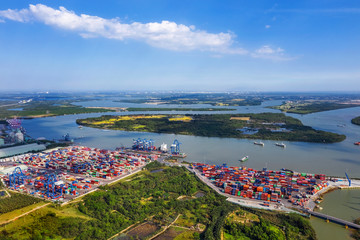 Wall Mural - Top view aerial of Cat Lai container harbor, center Ho Chi Minh City, Vietnam with development buildings, transportation, energy power infrastructure.