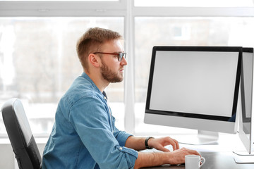 Male programmer working in office