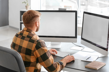 Male programmer working in office
