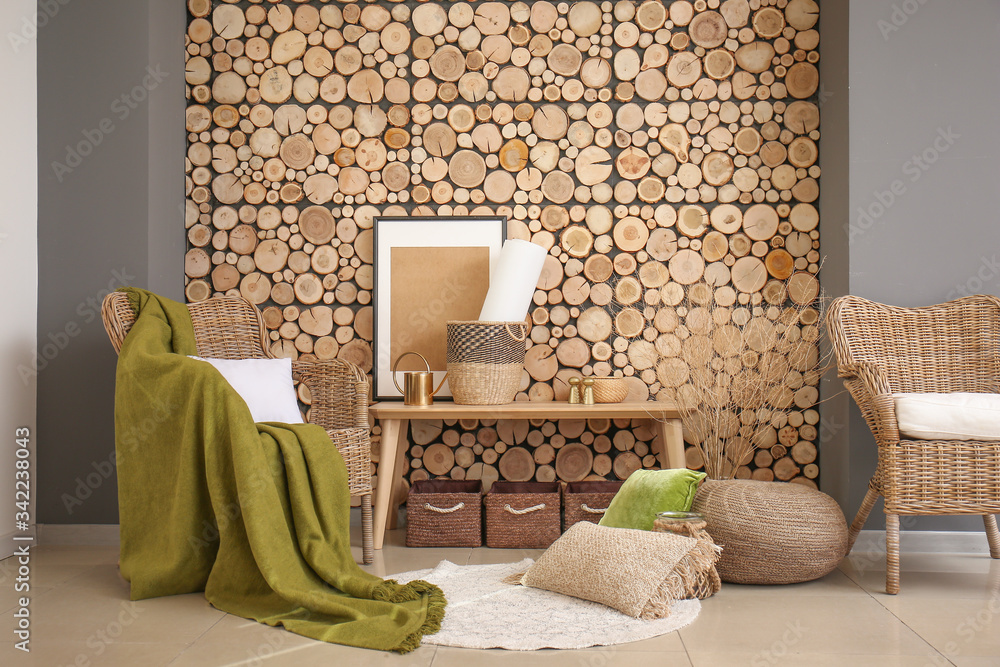 Interior of modern room with wicker armchair and table