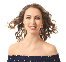 Poster - Beautiful young woman with curly hair on white background