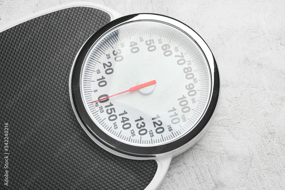 Weight scales on light background. Slimming concept