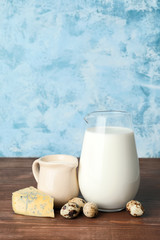 Different dairy products on wooden table