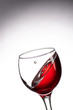 © Vasily Popov - drop falling into a glass with red wine and a splash at an amazing angle