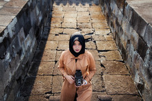 Woman Wearing Hijab And Brown Coat With Classic Twin Lens Reflex Camera