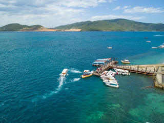 Aerial view of Hon Tam Island, Nha Trang Bay, Khanh Hoa, Vietnam. Hon Tam has all potentials of a class resort with deep blue sea harmonized with the golden sand and green tropical forest