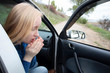 © Siniehina - Nausea during a car trip. A blonde woman suffers from kinetosis. The concept of motion sickness in diseases of the transport and vestibular apparatus