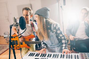 Wall Mural - kids rock band practice in music studio