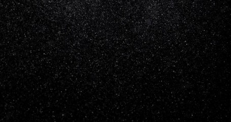 Wall Mural - Natural white winter snowfall on a black background video