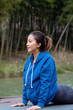 © 出 小 - A young Asian woman practicing yoga in the outdoors