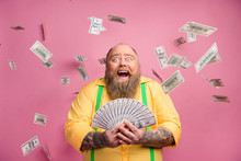 Close-up Portrait Of His He Nice Cheerful Cheery Wealthy Bearded Guy Holding In Hands Bunch Income Subsidy Donation Usd For New Life Isolated Over Pink Pastel Color Background