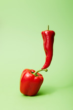 Chili Pepper On Red Bell Pepper On Green