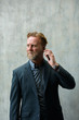 © Ranta Images - Mature handsome bearded businessman talking on the phone