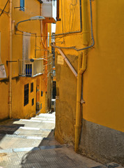 Wall Mural - View of a narrow street with steps, old buildings and facades in the historical city of Agrigento in Sicily, Italy