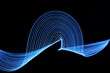 Long exposure photograph of blue neon colour in an abstract swirl, parallel lines pattern against a black background. Light painting photography.
