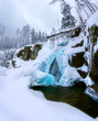 frozen waterfall in the mountains, blue ice, tatras slovakia
