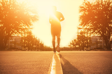 Wall Mural - Blurry subject Man running on road