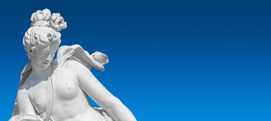 Banner with old statue of sensual renaissance era woman at blue smooth gradient background with copy space, Potsdam, Germany, details, closeup