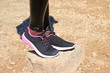 © sanek70974 - black sneakers on the stone