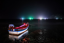 View Of Boats In Water At Night