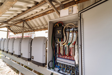 electrical panel at a assembly line factory. controls and switches. color wires in a box of distribu