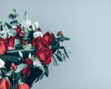 Close-up Of Rose Bouquet Against Gray Background