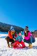 © FS-Stock - Happy Family In Snow Riding On Sledge.